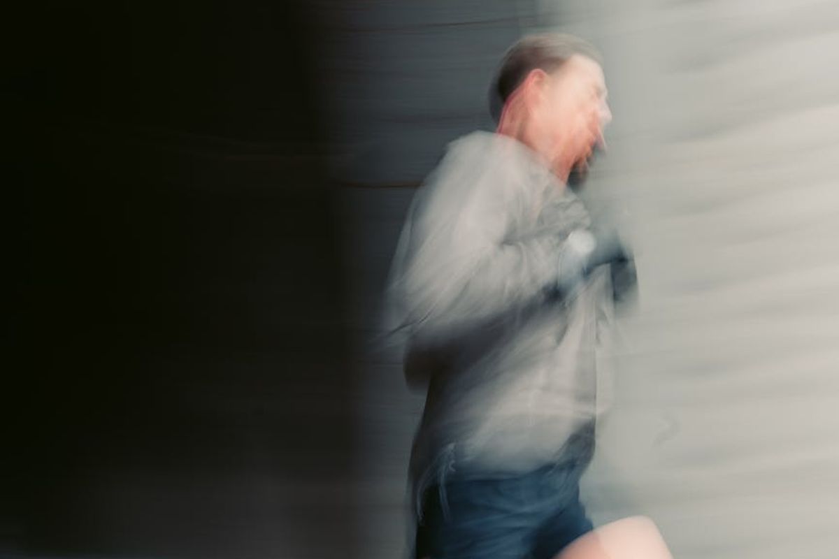 Athlete in motion with blurred background showcasing speed and energy